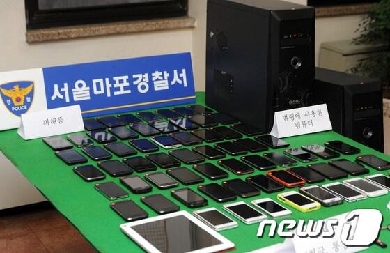 본문 이미지 - 중국으로 밀반출하려다 경찰에 적발, 압수된 도난·분실 스마트폰 증거물품. © News1 양동욱 기자