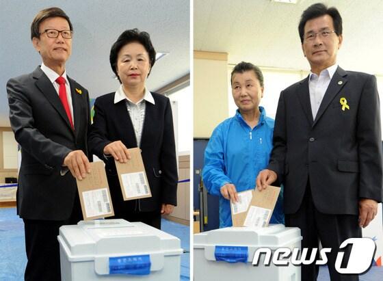 본문 이미지 - 윤진식(왼쪽) 새누리 충북지사 후보, 부인 백경애씨와 이시종 새정치민주연합 충북지사 후보, 부인 김옥신씨가 30일 오전 충북 청주시 금천동 주민센터, 복대1동 주민센터에서 각각 사전투표를 하고 있다. 2014.5.30/뉴스1 © News1   김용빈 기자