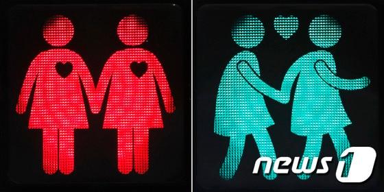 본문 이미지 - 오스트리아 비엔나에 손을 맞잡은 게이·레즈비언 커플 모양 신호등이 등장했다. ⓒAFP=뉴스1