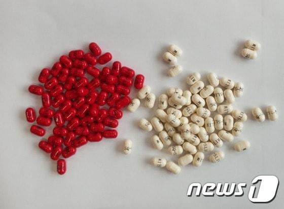 본문 이미지 - 부산 부산진경찰서는 9일 유해성분이 섞인 다이어트 식품을 국내에 몰래 들여와 판매한 일당을 검거했다고 밝혔다. 중국 조선족들이 국내에서 판매한 '인니 다이어트' 알약.(부산 부산진경찰서 제공)ⓒ News1