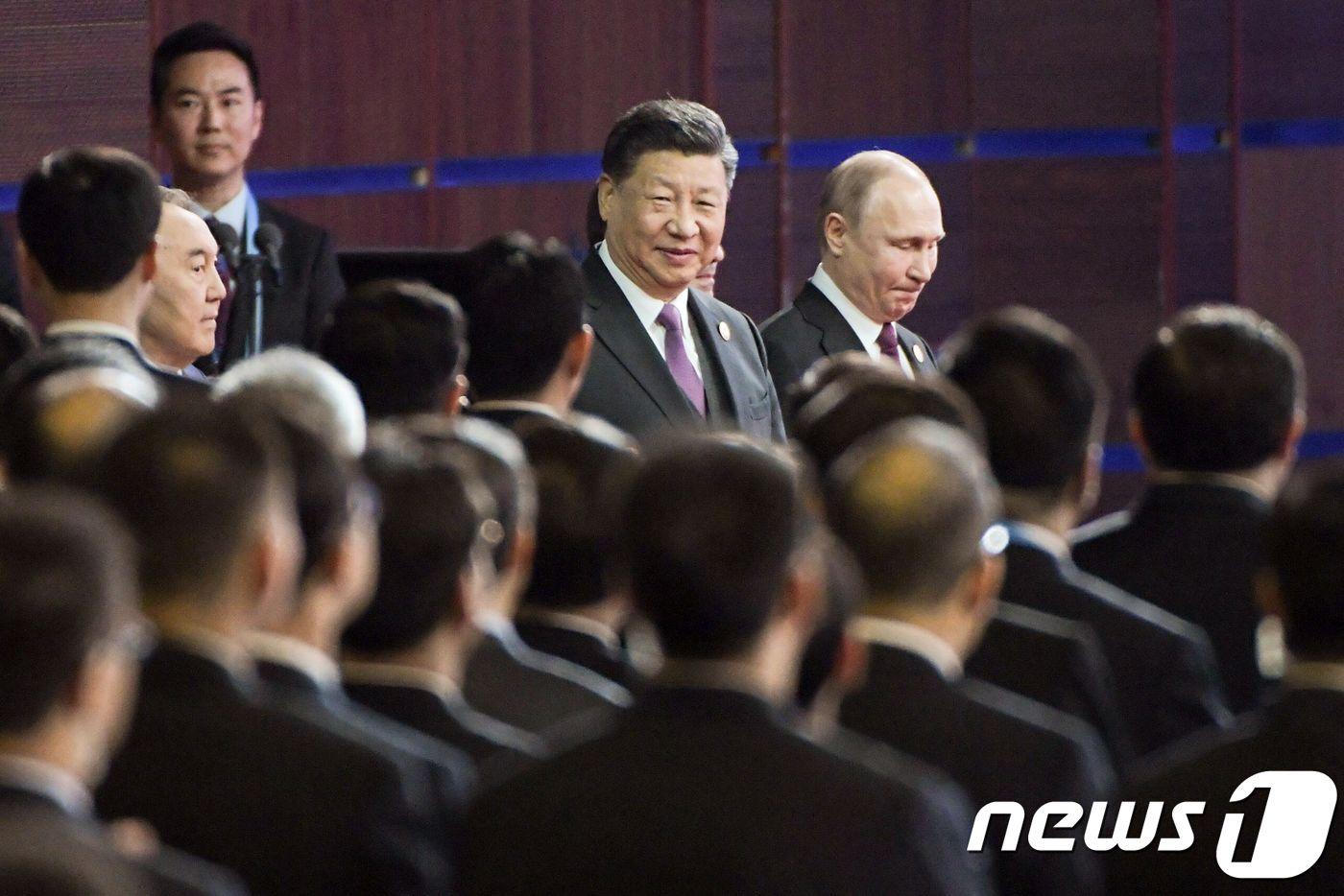 시진핑 중국 국가주석과 블라디미르 푸틴 러시아 대통령이 26일(현지시간) 베이징에서 열린 일대일로 국제협력 정상포럼 개막식에 함께 도착하고 있다. 2019.04.26 ⓒ AFP=뉴스1 ⓒ News1 우동명 기자