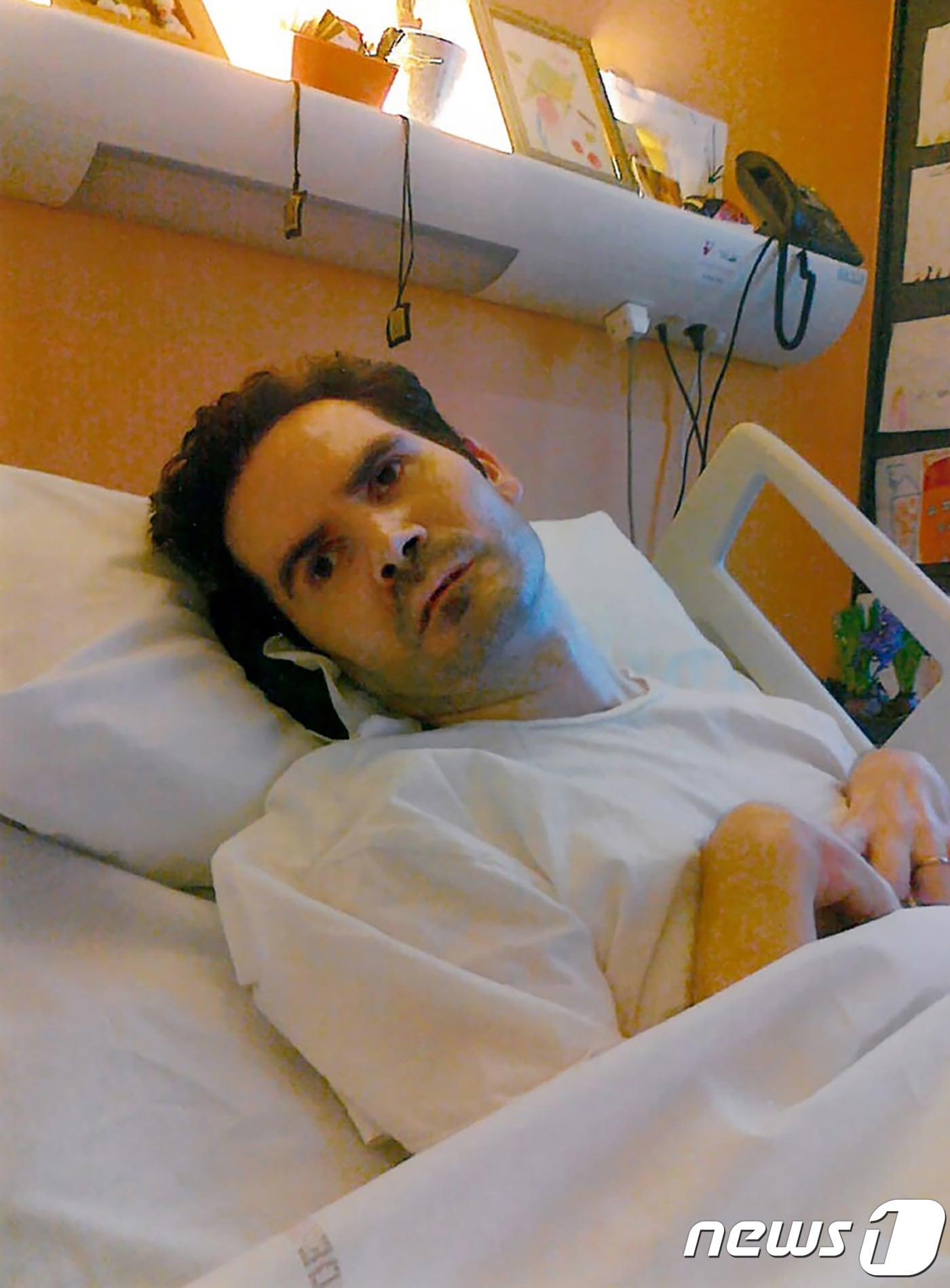 본문 이미지 - 식물인간 판정을 받고 11년째 병상에 누워있는 뱅상 랑베르. ⓒ AFP=뉴스1