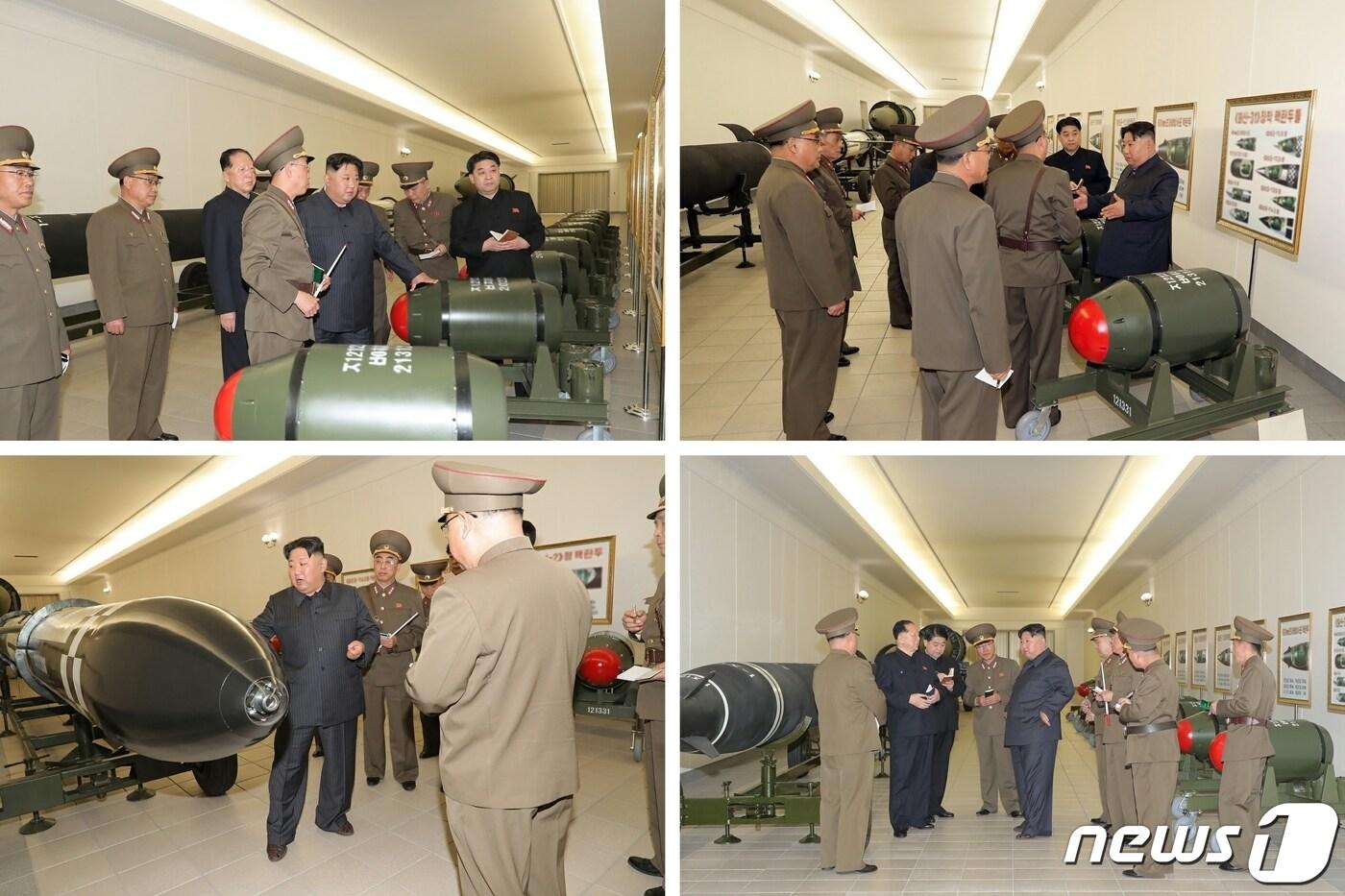 본문 이미지 - (평양 노동신문=뉴스1) = 북한 김정은 노동당 총비서가 27일 핵무기병기화사업을 지도했다고 당 기관지 노동신문이 28일 보도했다. 김 총비서와 간부들이 몸체는 녹색, 앞부분은 붉은색으로 도색된 새로운 핵탄두 추정 물체 앞에서 대화를 나누고 있다. [국내에서만 사용가능. 재배포 금지. DB 금지. For Use Only in the Republic of Korea. Redistribution Prohibited] rodongphoto@news1.kr