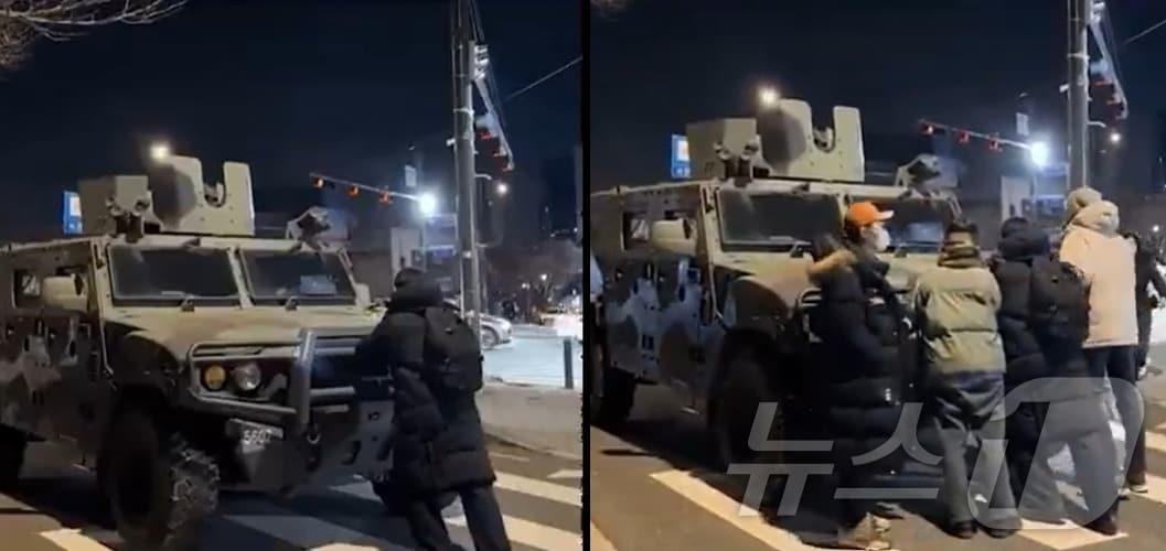 본문 이미지 - 지난 3일 밤 국회로 출동하는 군 장갑차를 한 청년이 가로막아섰다. 이를 본 시민들이 합세, 출동을 막았다. (워싱턴 포스트 유튜브 갈무리)  ⓒ 뉴스1