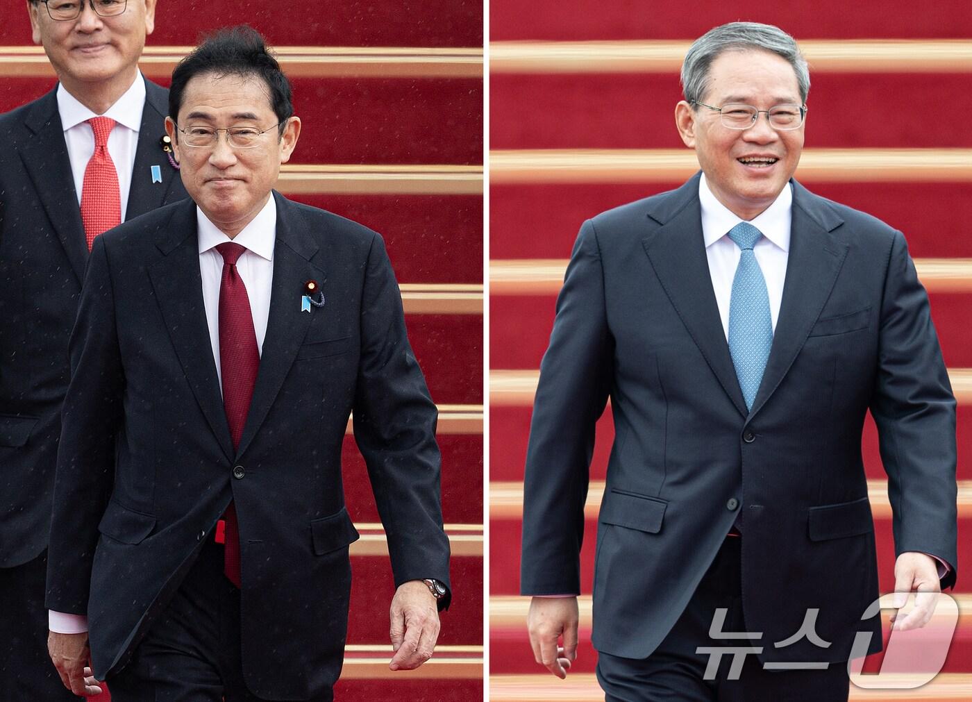 본문 이미지 - 기시다 후미오&#40;岸田文雄&#41; 일본 총리&#40;왼쪽&#41;와 리창 중국 국무원 총리가 26일 한일중 정상회의 참석차 경기도 성남시 서울공항에 도착하고 있다. 2024.5.26/뉴스1 ⓒ News1 이재명 기자