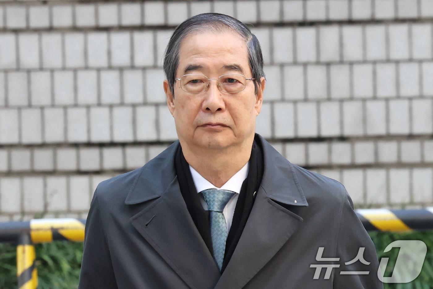 한덕수 전 국무총리가 5일 오전 서울 서초구 서울중앙지방법원에서 열린 내란 우두머리 방조 및 위증 등 혐의 재판에 출석하고 있다. 2025.11.5/뉴스1 ⓒ News1 이광호 기자