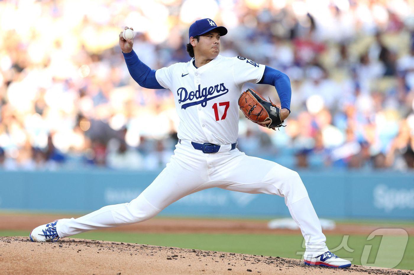 LA 다저스 오타니 쇼헤이가 28일(한국시간) 열린 2025 메이저리그 신시내티 레즈전에서 선발 등판해 5이닝 9탈삼진 1실점 호투를 펼쳐 승리를 수확했다. ⓒ AFP=뉴스1