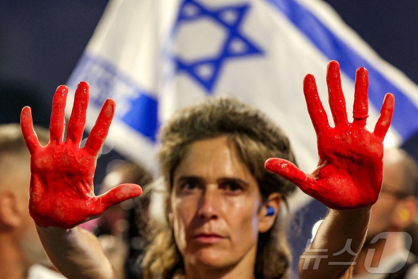 이스라엘 텔아비브에서 하마스에 잡혀간 인질을 석방하기 위한 정부 조치를 촉구하는 시위가 열리고 있다. 2025.08.02 ⓒ AFP=뉴스1 ⓒ News1 이지예 객원기자