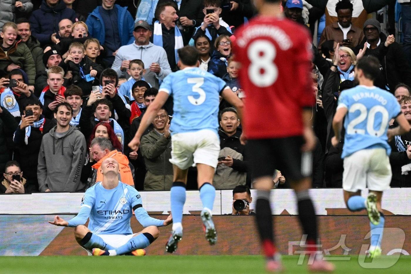 맨체스터 시티 엘링 홀란드가 맨체스터 유나이티드를 상대로 득점 후 세리머니를 하고 있다. ⓒ AFP=뉴스1
