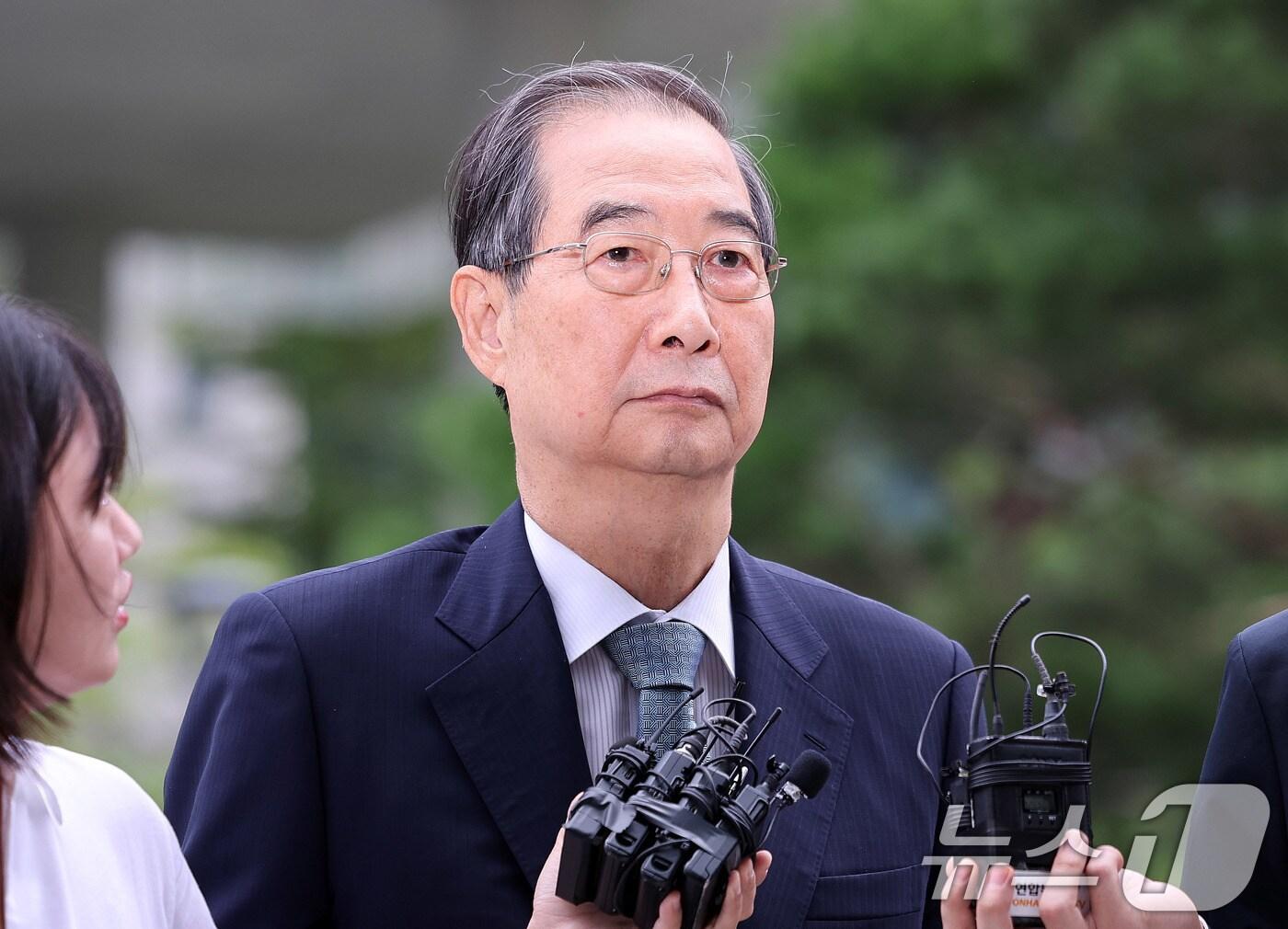 본문 이미지 - 한덕수 전 총리가 9일 서울 종로구 광화문에 마련된 김건희 특검팀 사무실에 조사를 받기 위해 출석하고 있다. 2025.9.9/뉴스1 ⓒ News1 박지혜 기자