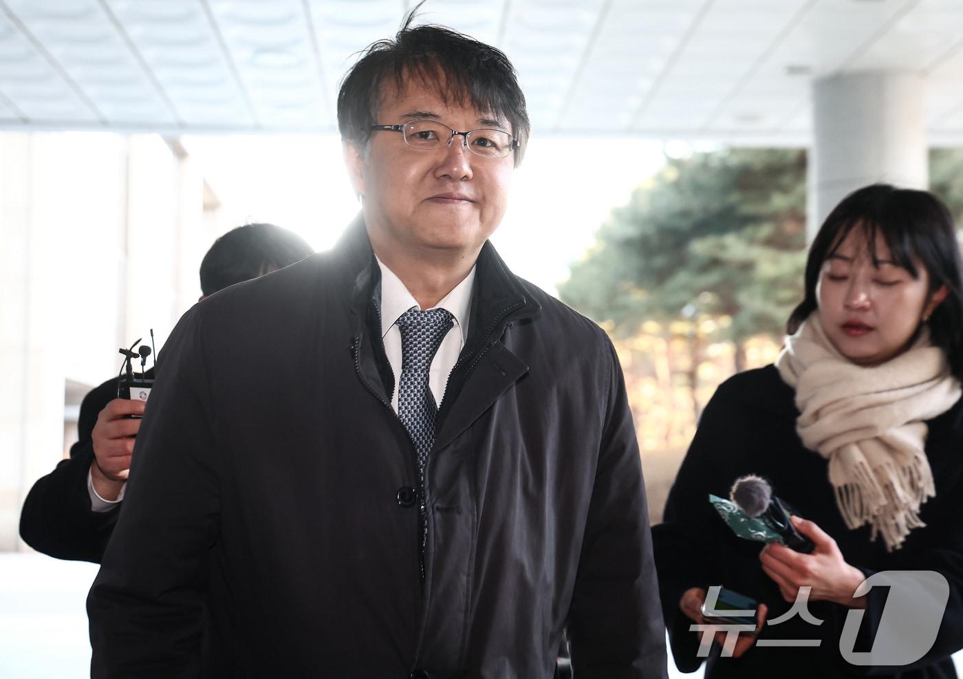 본문 이미지 - 통일교와 신천지의 정교유착 의혹을 수사하는 합동수사본부를 이끌게 된 김태훈 본부장이 8일 오전 서울 서초구 서울고등검찰청으로 출근하고 있다. 2026.1.8/뉴스1 ⓒ News1 김민지 기자