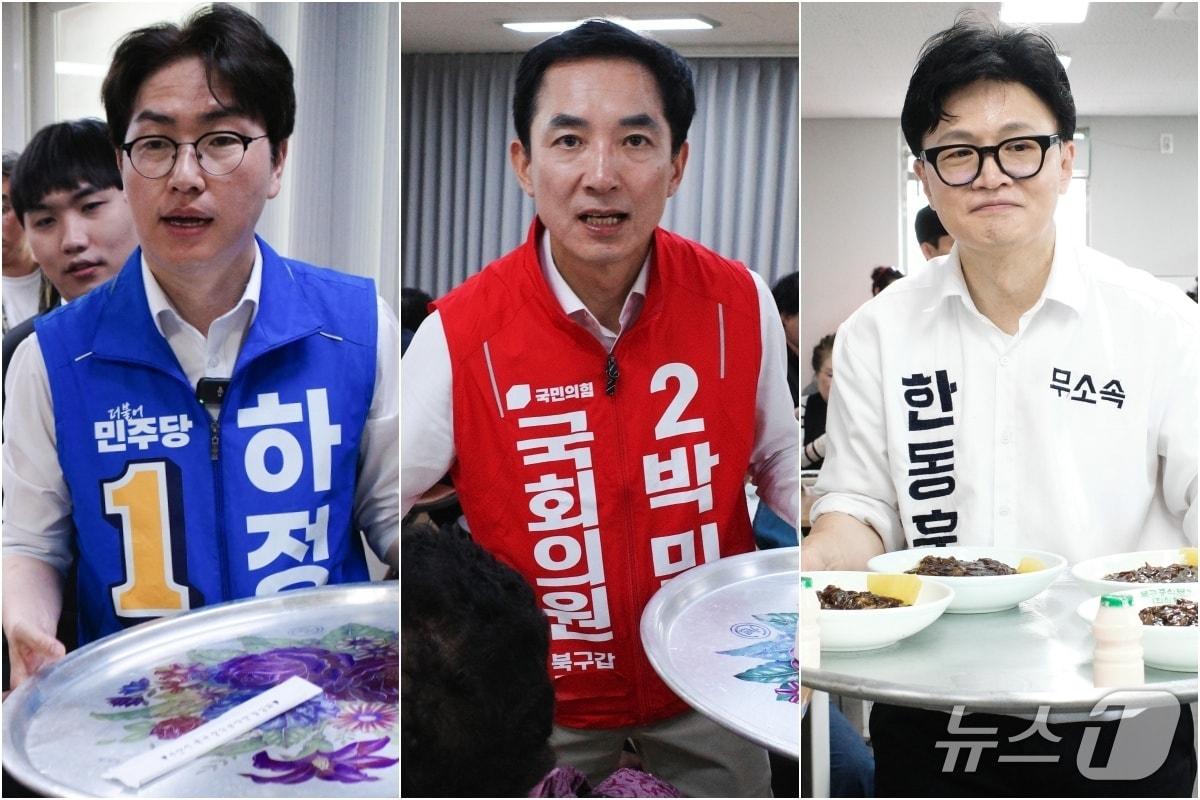본문 이미지 - 부산 북구갑 보궐선거에 출마하는 하정우 더불어민주당 후보, 박민식 국민의힘 후보, 한동훈 무소속 후보(왼쪽부터)가 12일 부산 북구 덕천종합사회복지관에서 짜장면 배식 봉사를 하고 있다. 2026.05.12 ⓒ 뉴스1 김세정 기자, 홍윤 기자