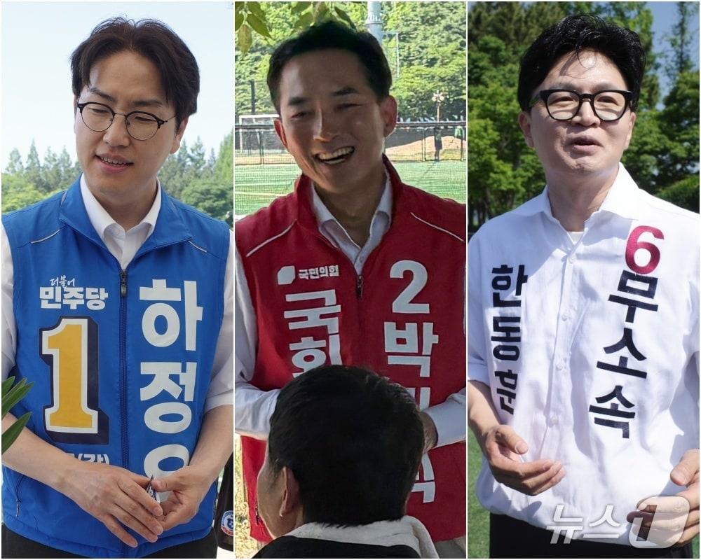 본문 이미지 - 부산 북구갑 국회의원 보궐선거에 출마한 하정우 더불어민주당 후보, 박민식 국민의힘 후보, 한동훈 무소속 후보가 17일 부산 북구 화명생태공원에서 열린 북구축구협회장기 대회에 참석해 주민들과 인사를 나누고 있다. 2026.05.17 ⓒ 뉴스1 김세정 기자, 홍윤 기자