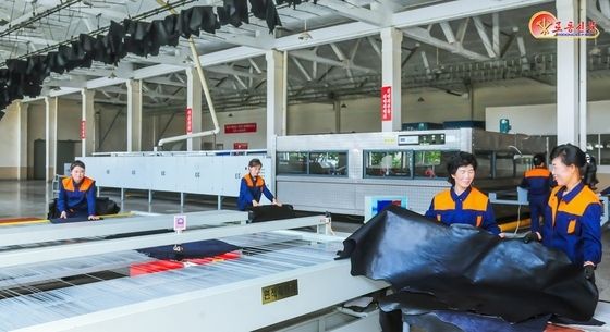 北 "당 결정 관철 위한 생산 투쟁…평양 가죽공장 조명
