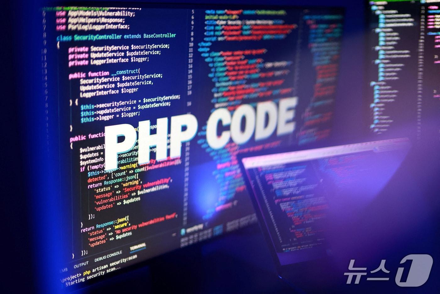 본문 이미지 - Illustration shows "PHP Code" text and PHP code ⓒ 로이터=뉴스1